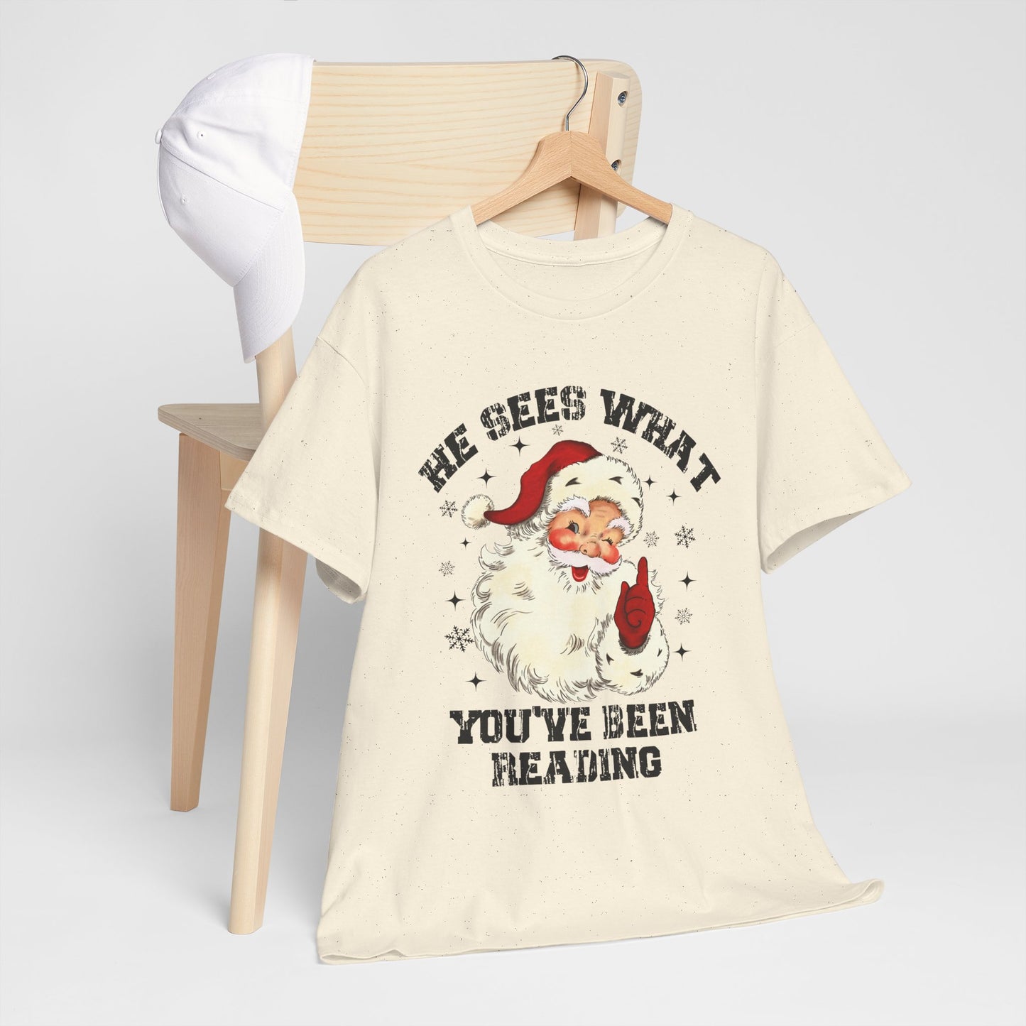 Santa Graphic T-Shirt — “He Sees What You’ve Been Reading” Christmas Tee - Holiday Spicy Reading Tee
