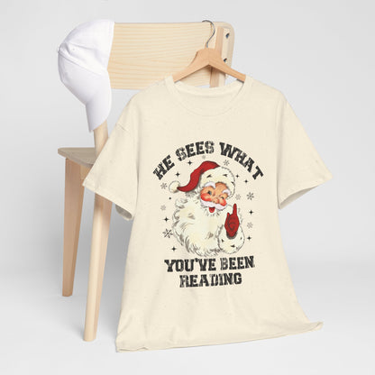 Santa Graphic T-Shirt — “He Sees What You’ve Been Reading” Christmas Tee - Holiday Spicy Reading Tee