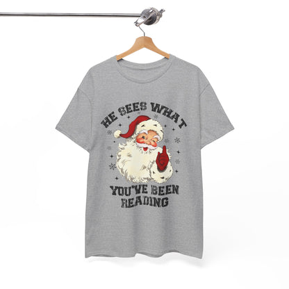 Santa Graphic T-Shirt — “He Sees What You’ve Been Reading” Christmas Tee - Holiday Spicy Reading Tee